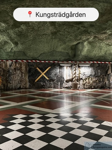 Kungstradgarden metro station platform with checked tiles