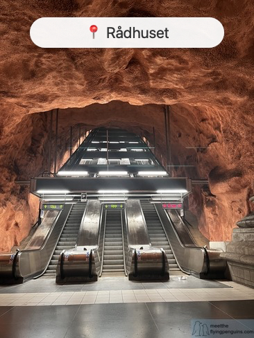 Radhuset metro station with exposed bedrock and warm tones